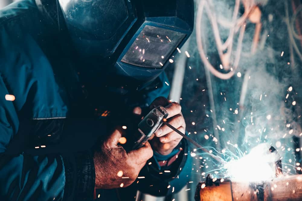 Welder working with protective equipment